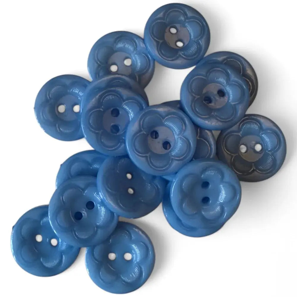 Pile of blue flower-shaped buttons.