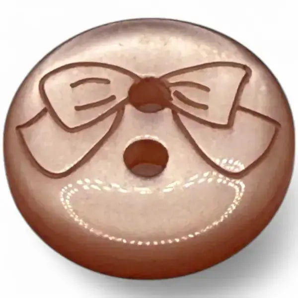 Round, rose-colored button with a bow design.