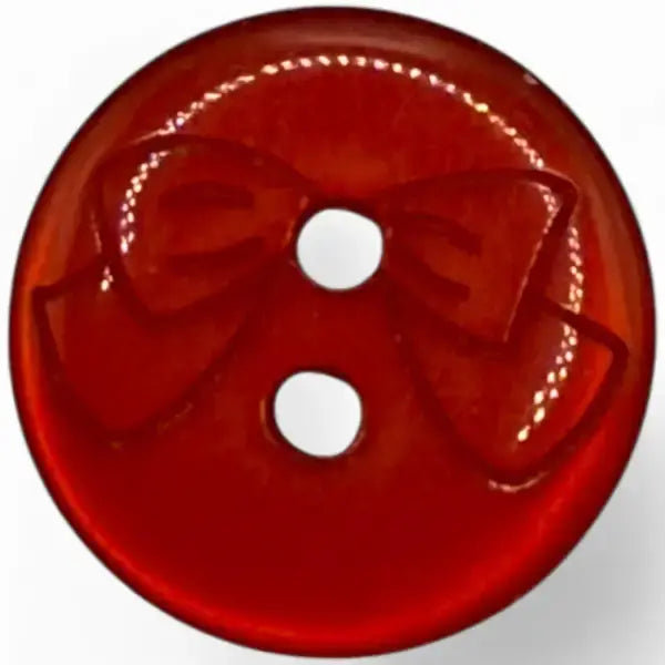 Red button with bow design.