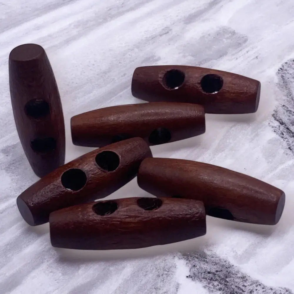 Brown wooden toggle buttons.