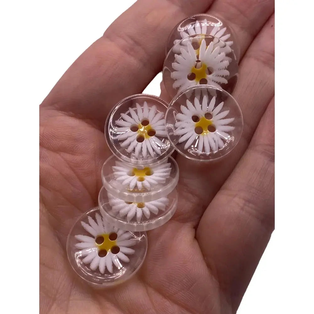 Daisy-themed clear buttons.