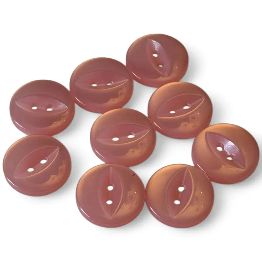 Round, mauve-colored buttons with leaf-shaped indentations.