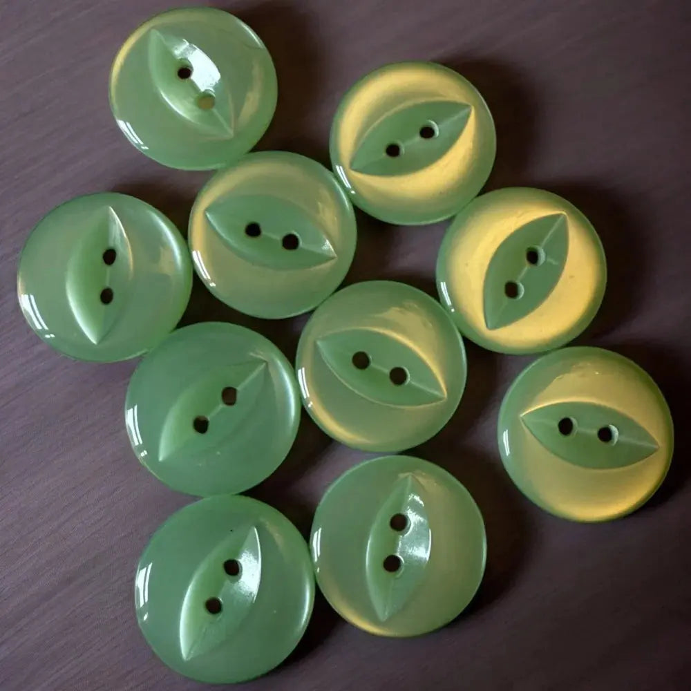 Collection of green leaf-shaped buttons.