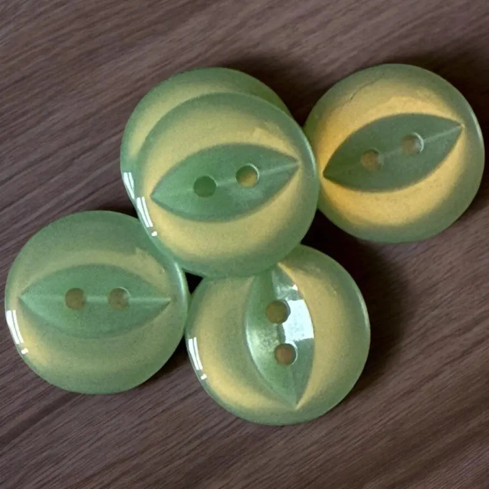 Five round, two-hole, green and yellow buttons.