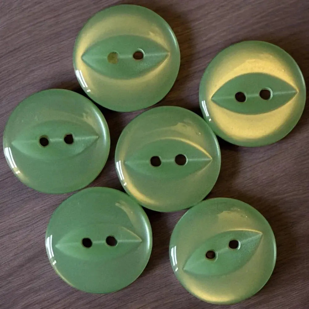 Green, round, two-hole buttons.