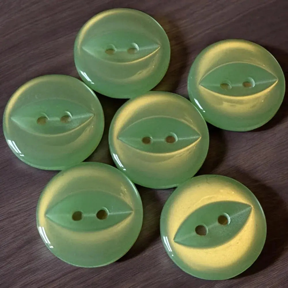 Six green, two-hole buttons.