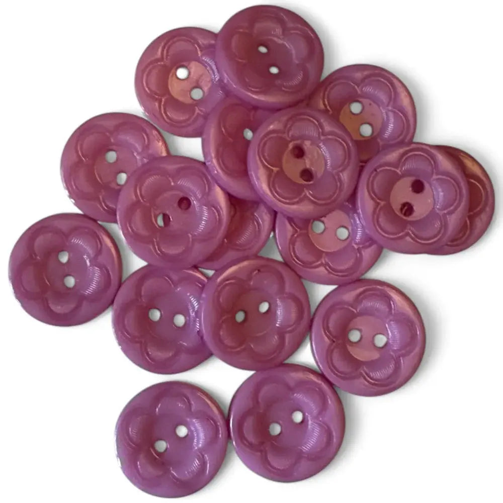 Pile of mauve flower-shaped buttons.