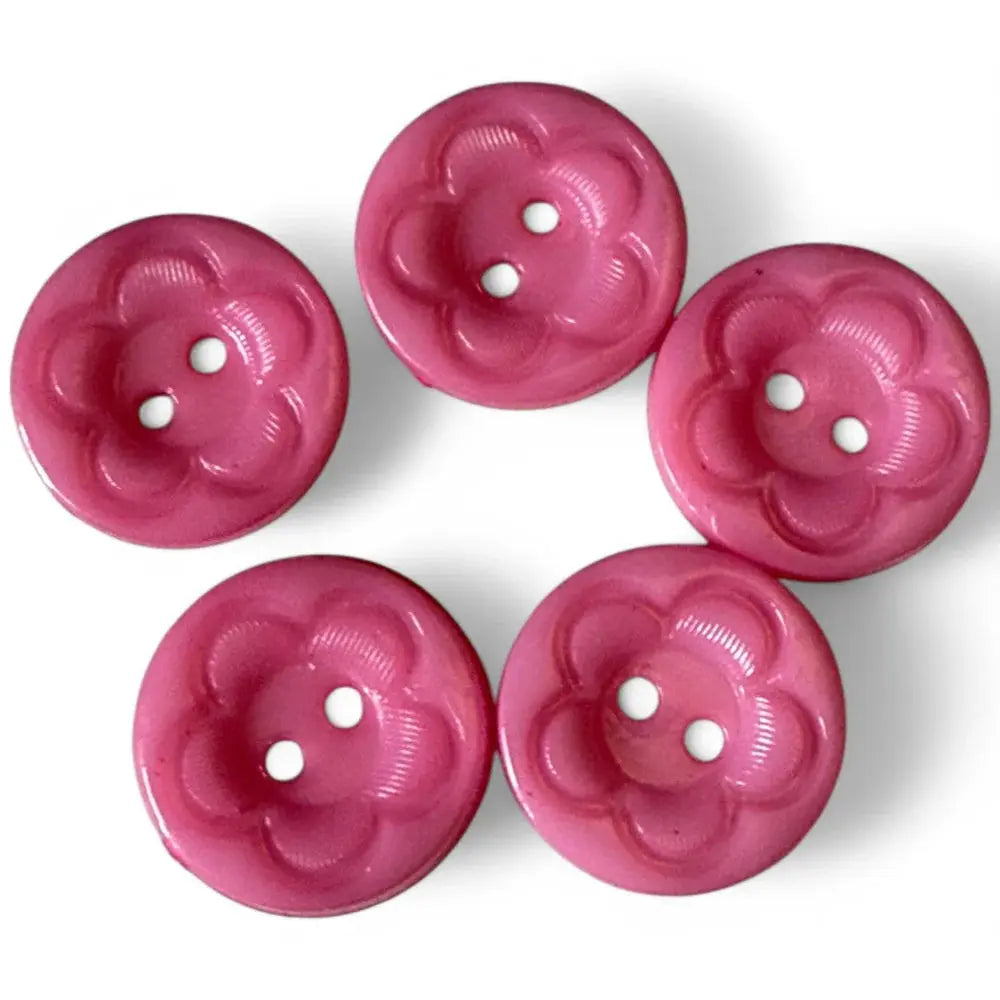 Five pink flower-shaped buttons.