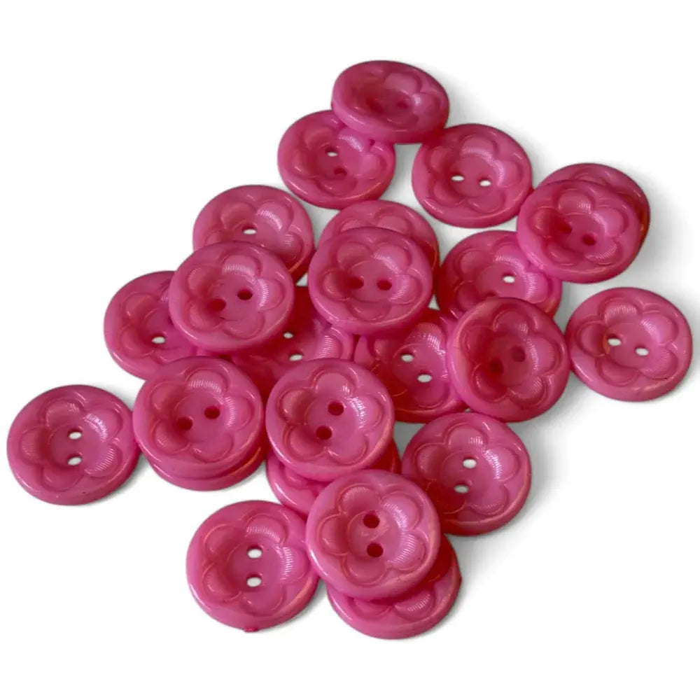 Pile of pink flower-shaped buttons.