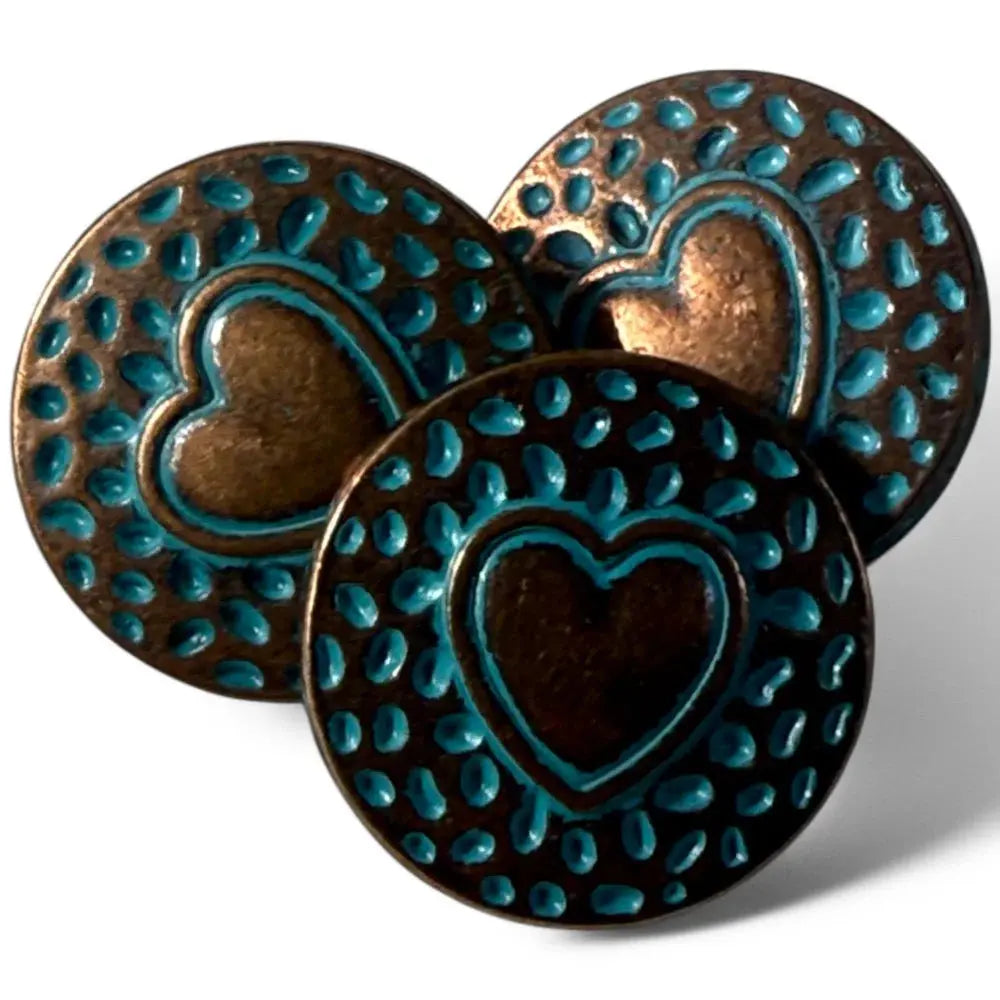 Three bronze heart-shaped buttons with turquoise accents.