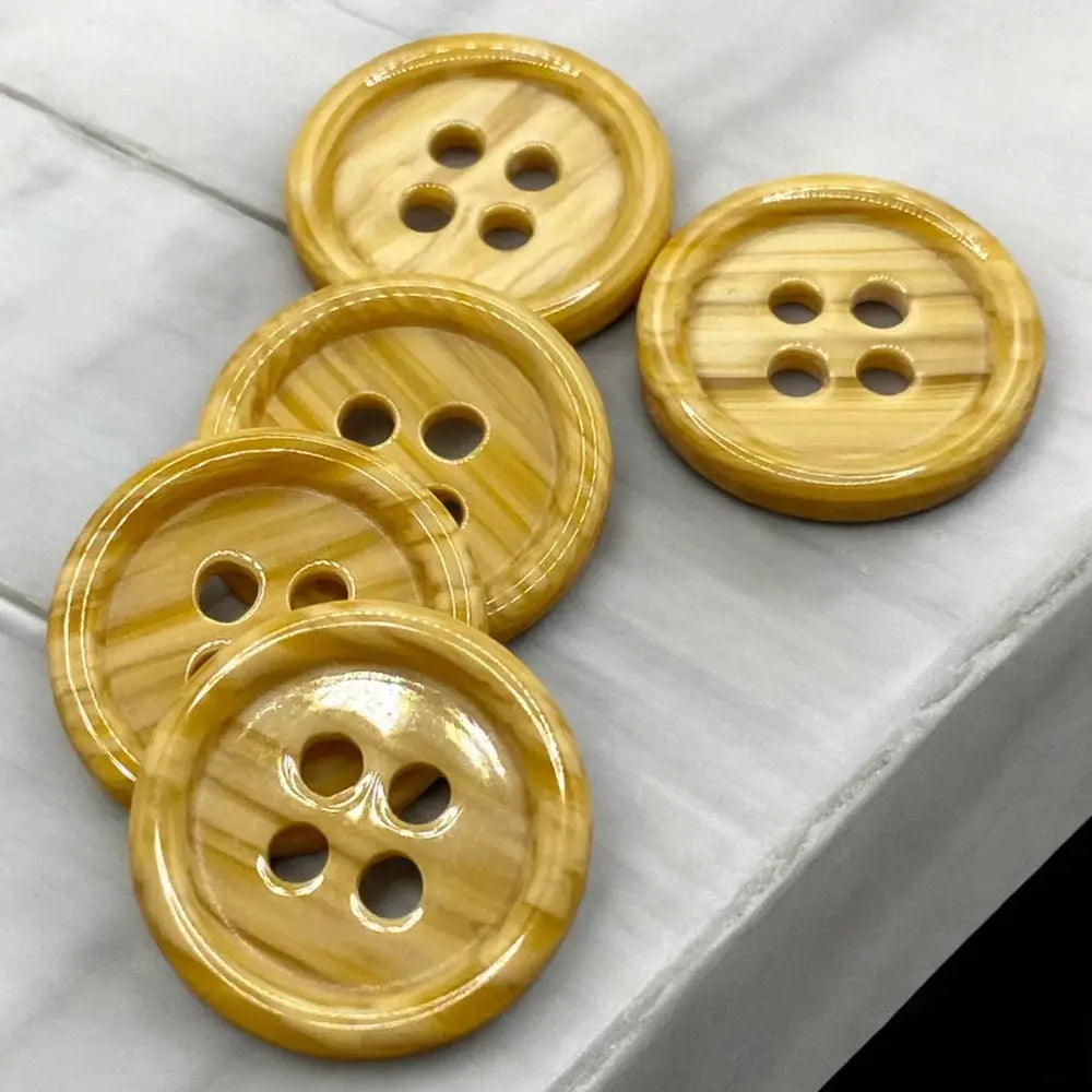 Round, four-hole, wood-grain buttons.