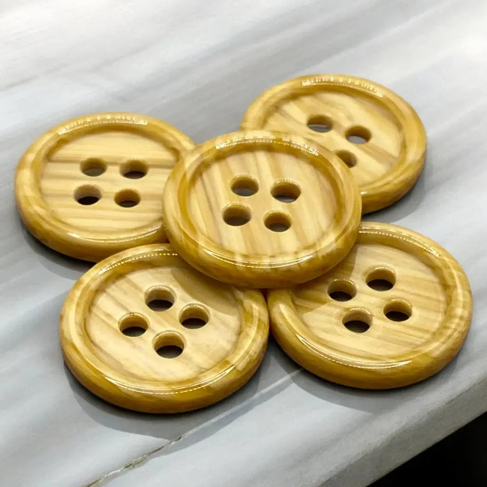 Five wooden four-hole buttons.