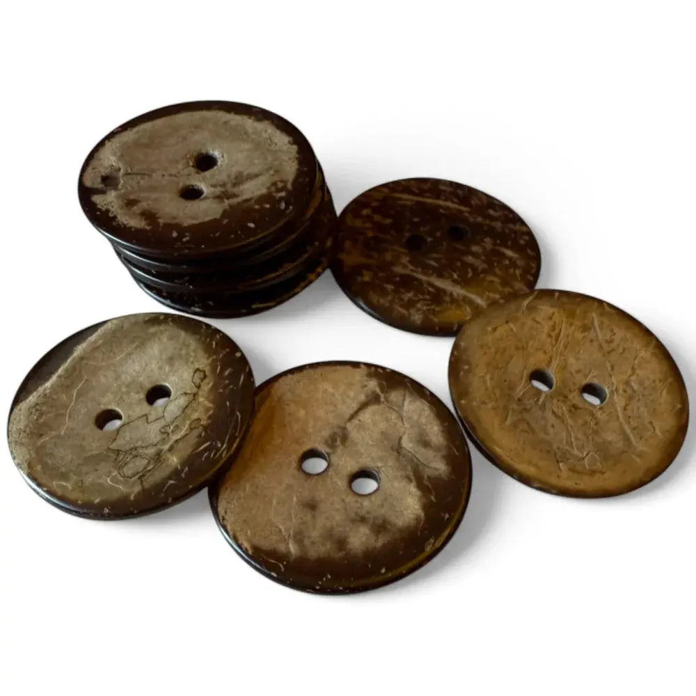 Pile of brown coconut buttons.
