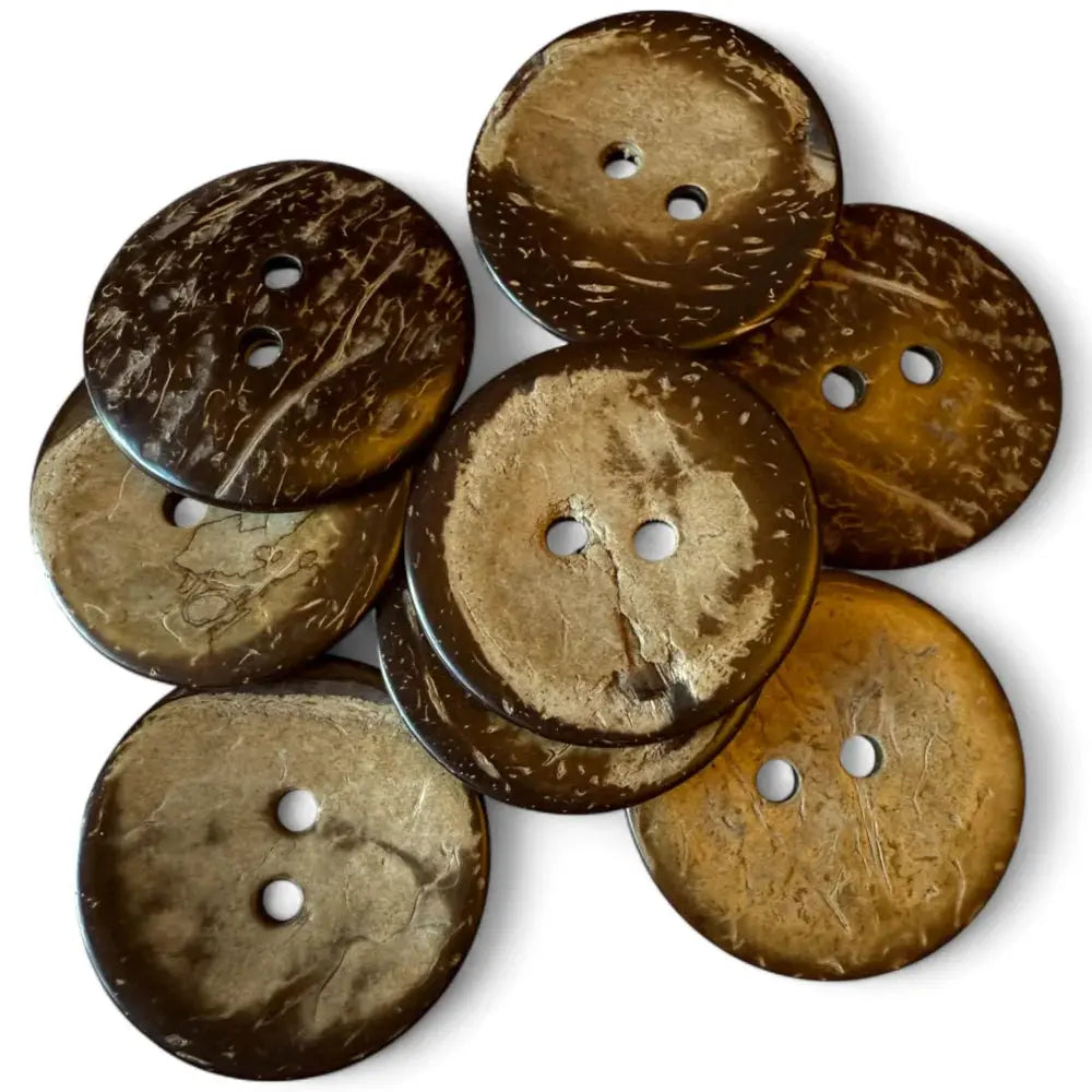 Pile of two-hole coconut buttons.