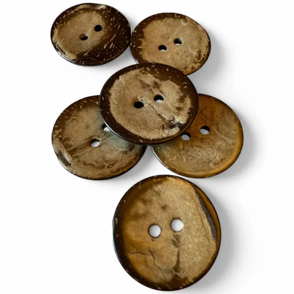 Six brown coconut buttons.