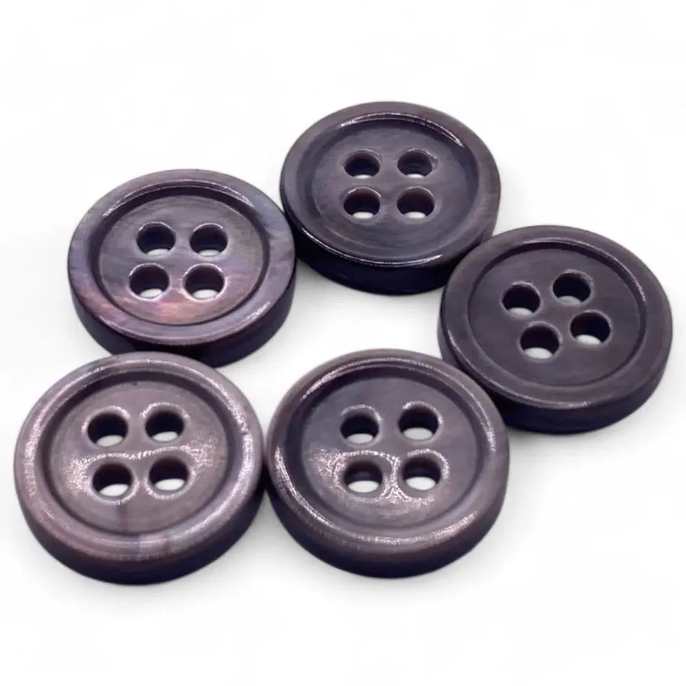 Five dark, four-hole buttons.