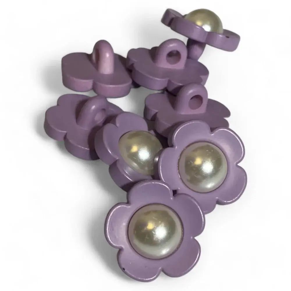 Lilac flower buttons with pearl centers.