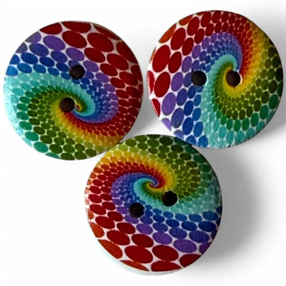 Three rainbow swirl buttons.