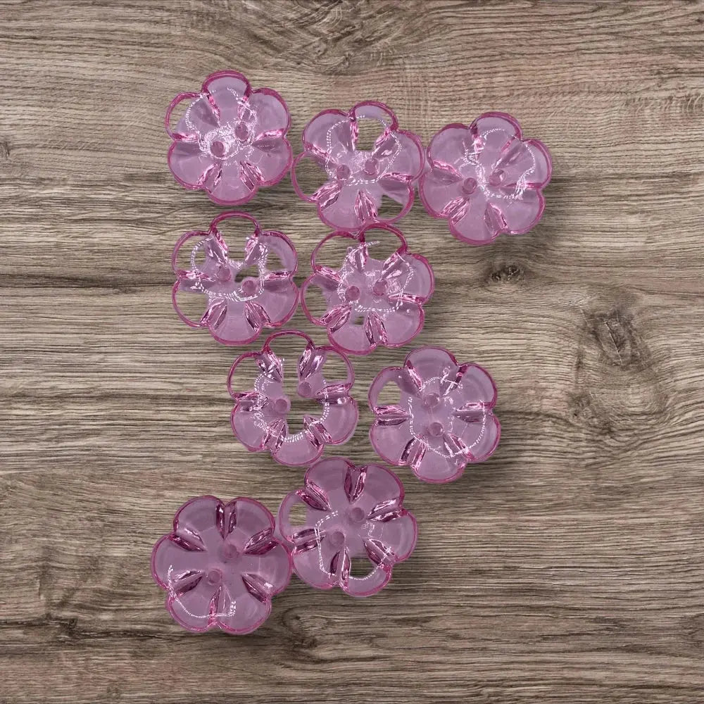 Translucent pink flower-shaped buttons.