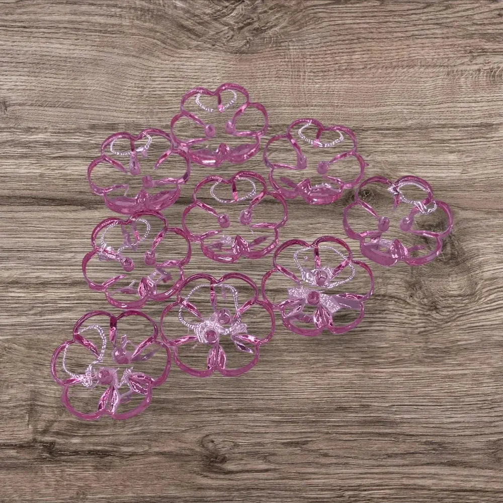 Pink flower-shaped plastic coasters.