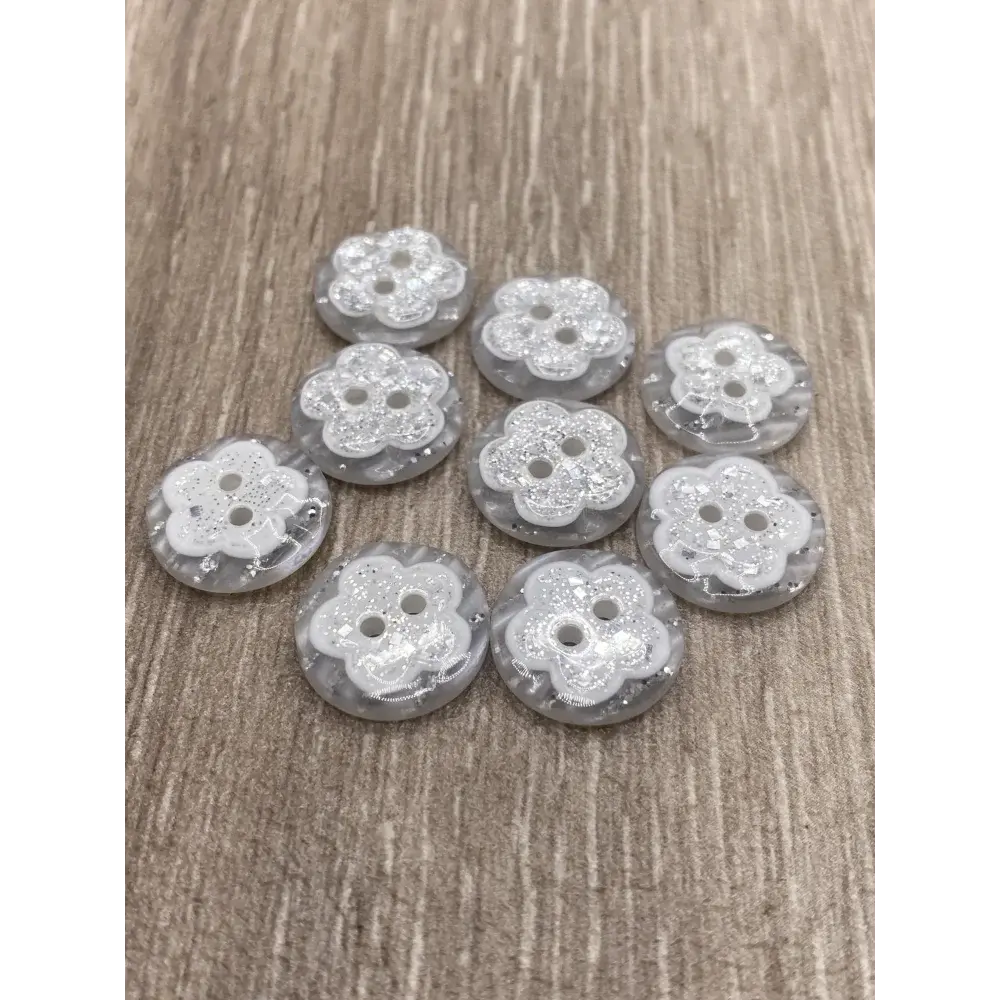 Ten flower-shaped buttons.