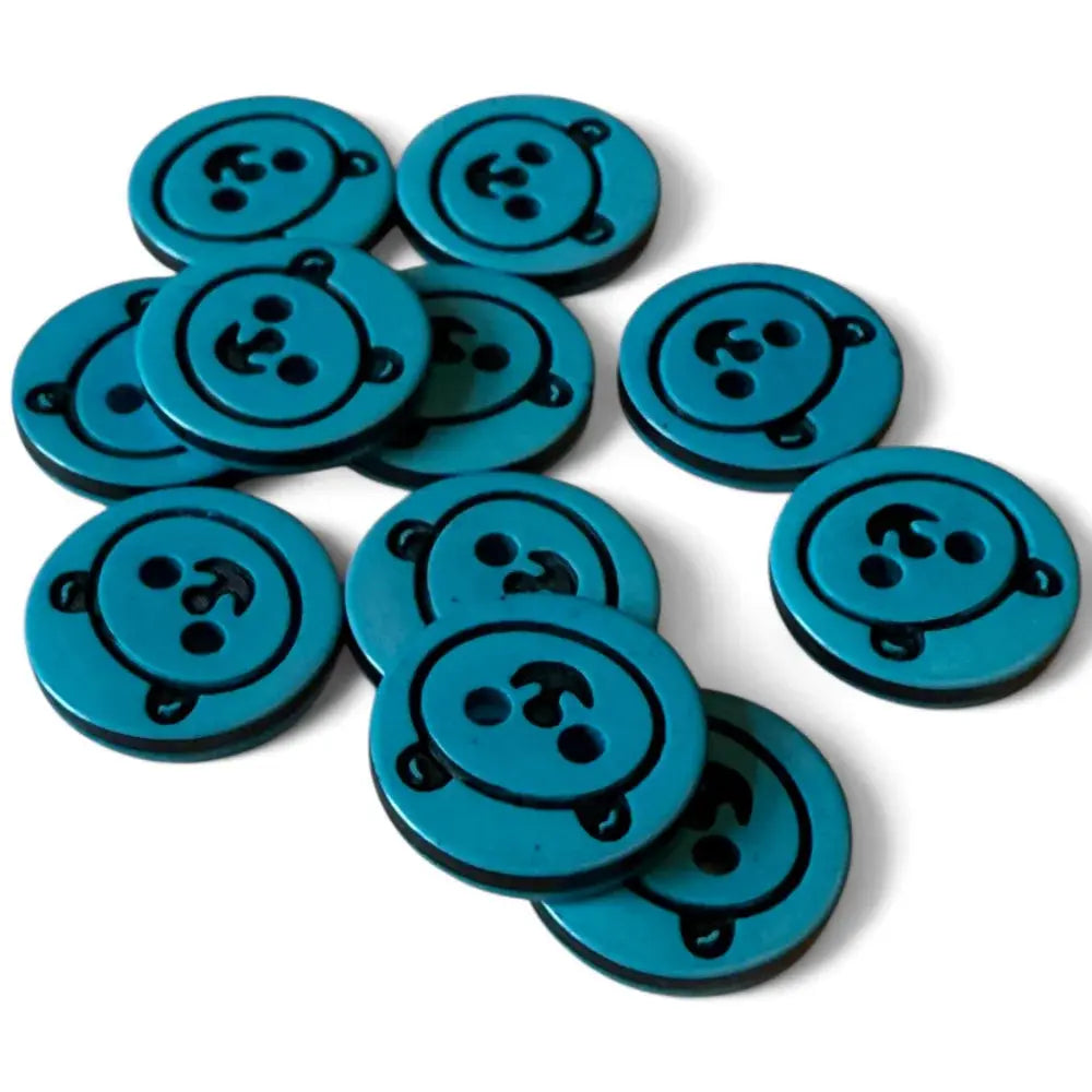 Teal round buttons with three holes.