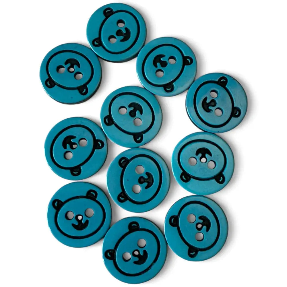 Turquoise buttons with bear face design.