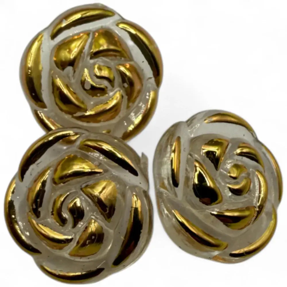 Three gold-accented rose buttons.