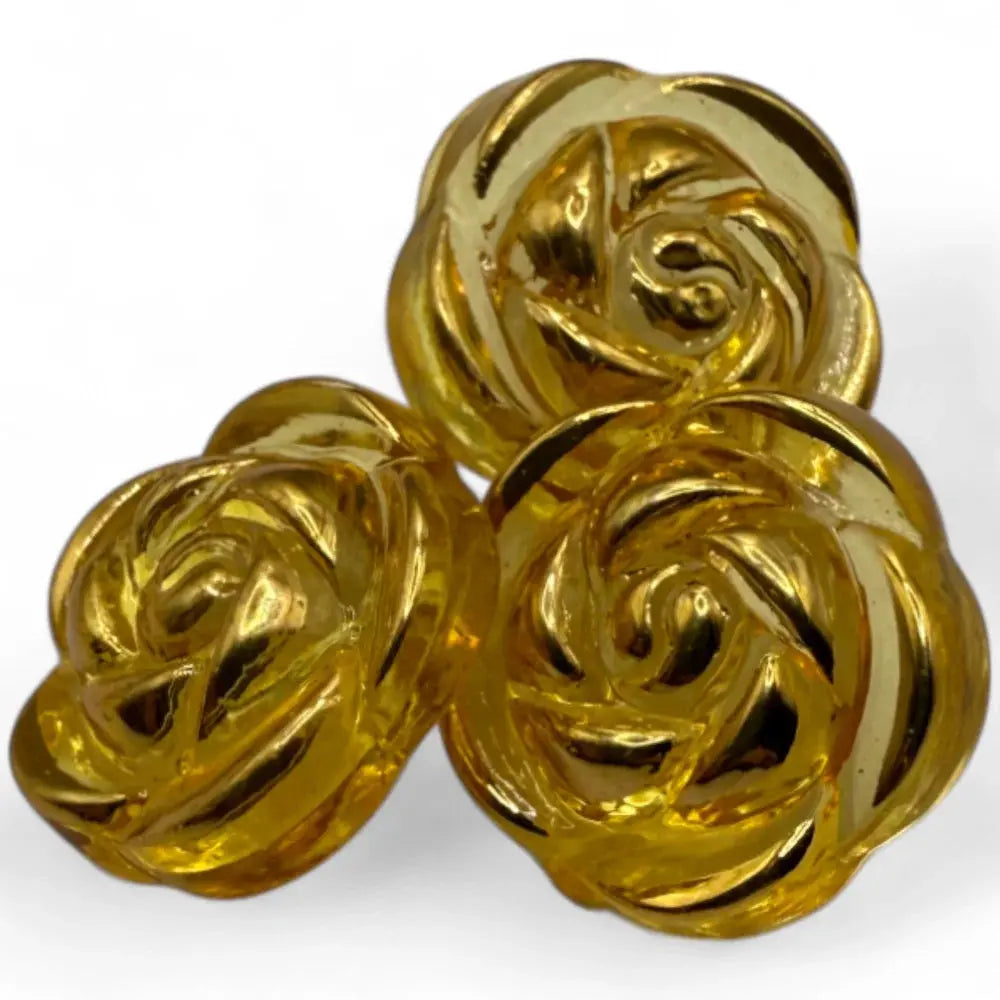 Three golden rose-shaped buttons.
