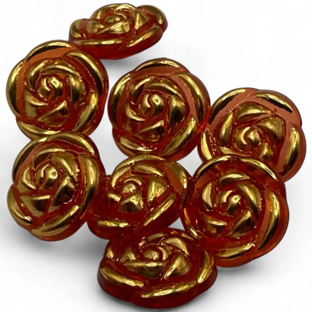 Rose-shaped, amber-colored buttons with gold accents.