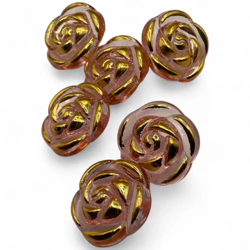 Pink and gold rose-shaped beads.