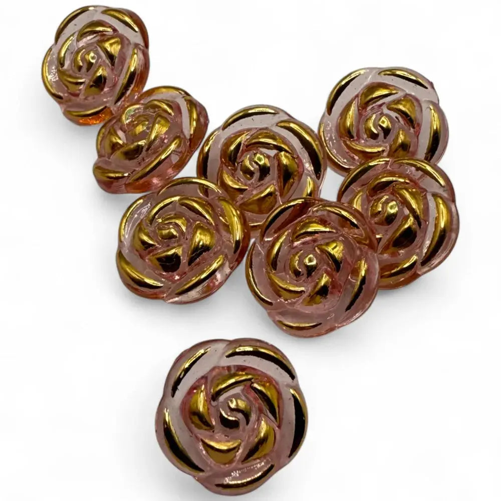 Rose-shaped, pink and gold glass beads.