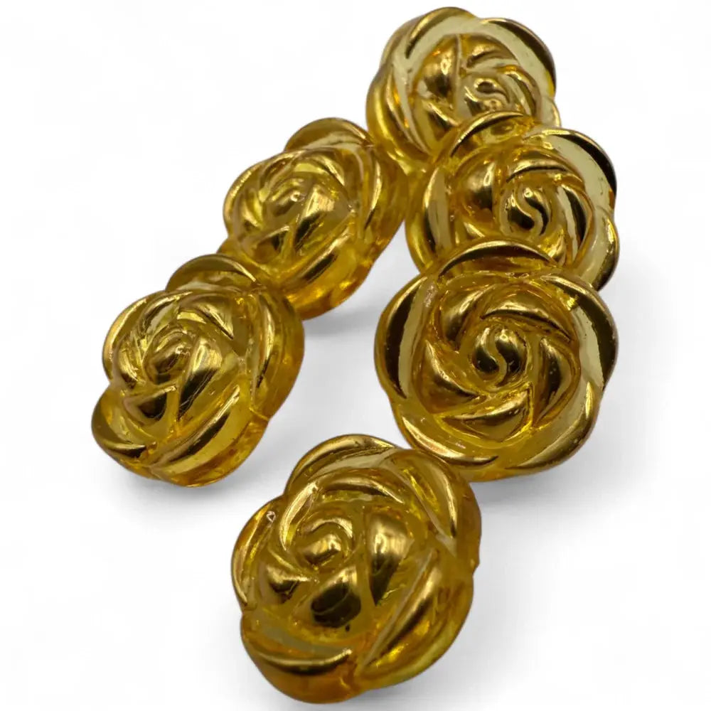 Golden rose-shaped buttons.