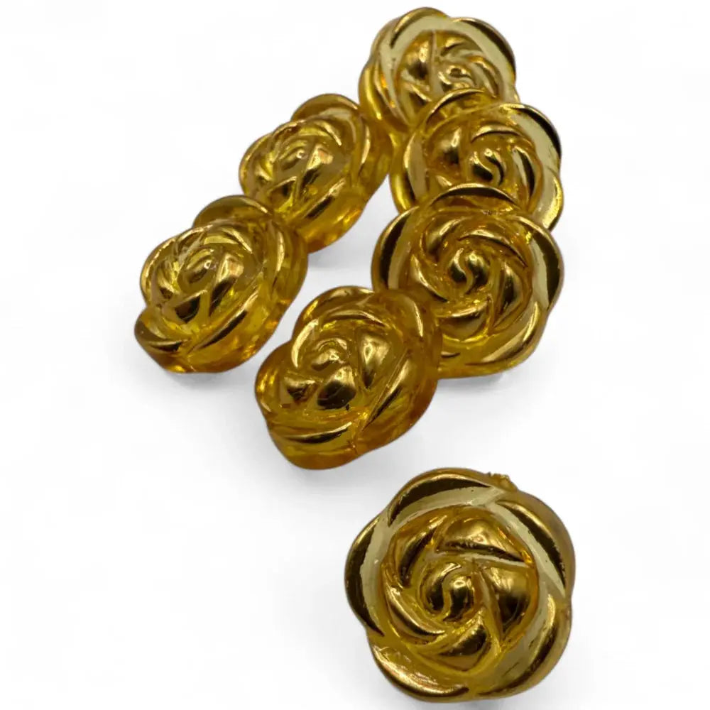 Golden rose-shaped buttons.