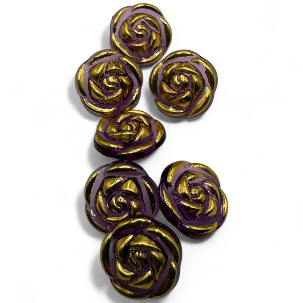 Purple and gold rose-shaped buttons.