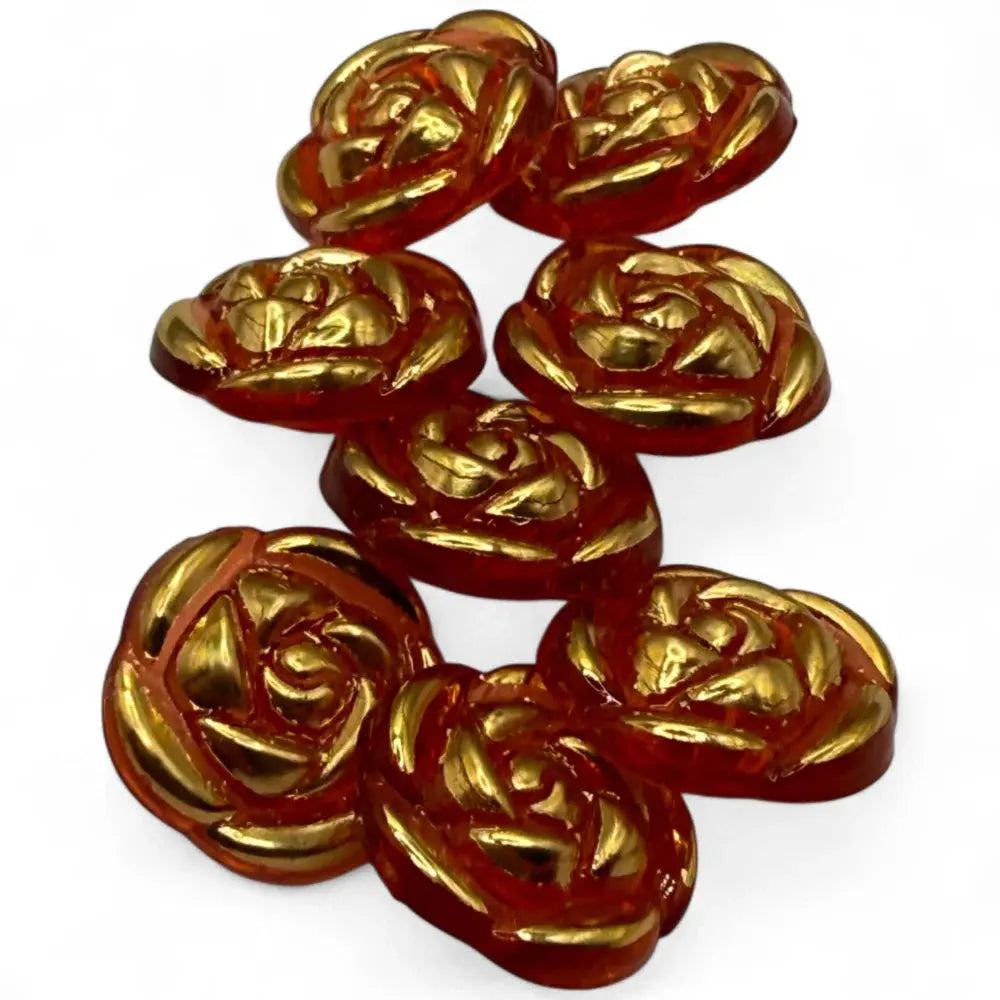Golden rose-shaped buttons.