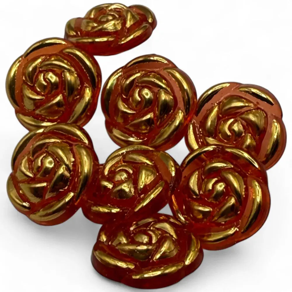 Rose-shaped, amber-colored buttons with gold accents.