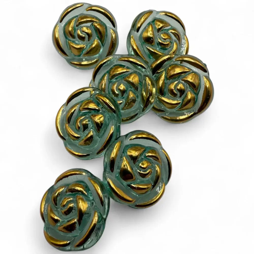 Seven rose-shaped glass buttons with gold accents.