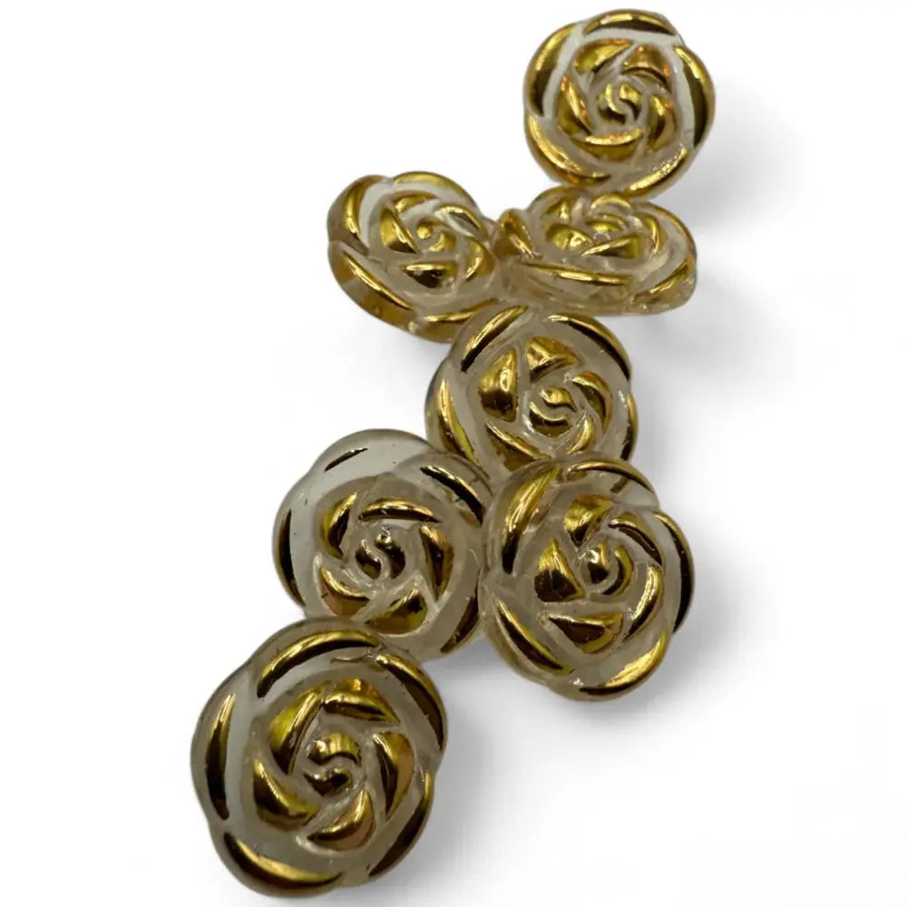Translucent rose-shaped buttons with gold accents.