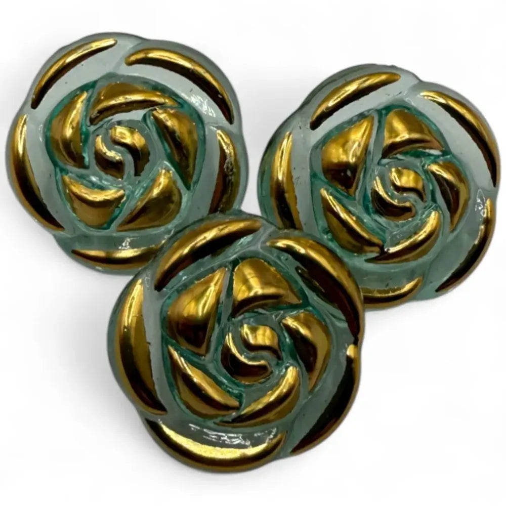Three decorative rose-shaped buttons.