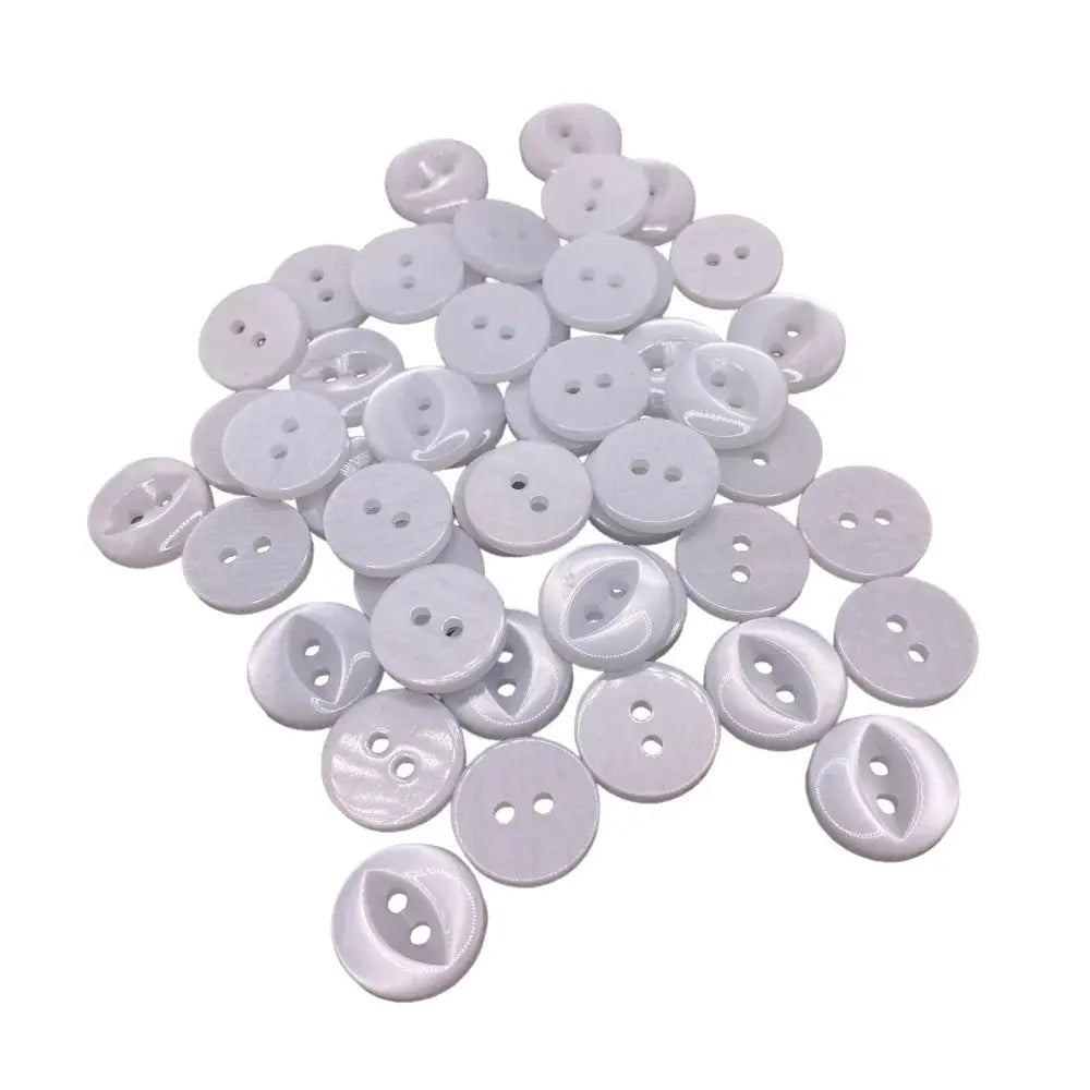 Pile of white two-hole buttons.