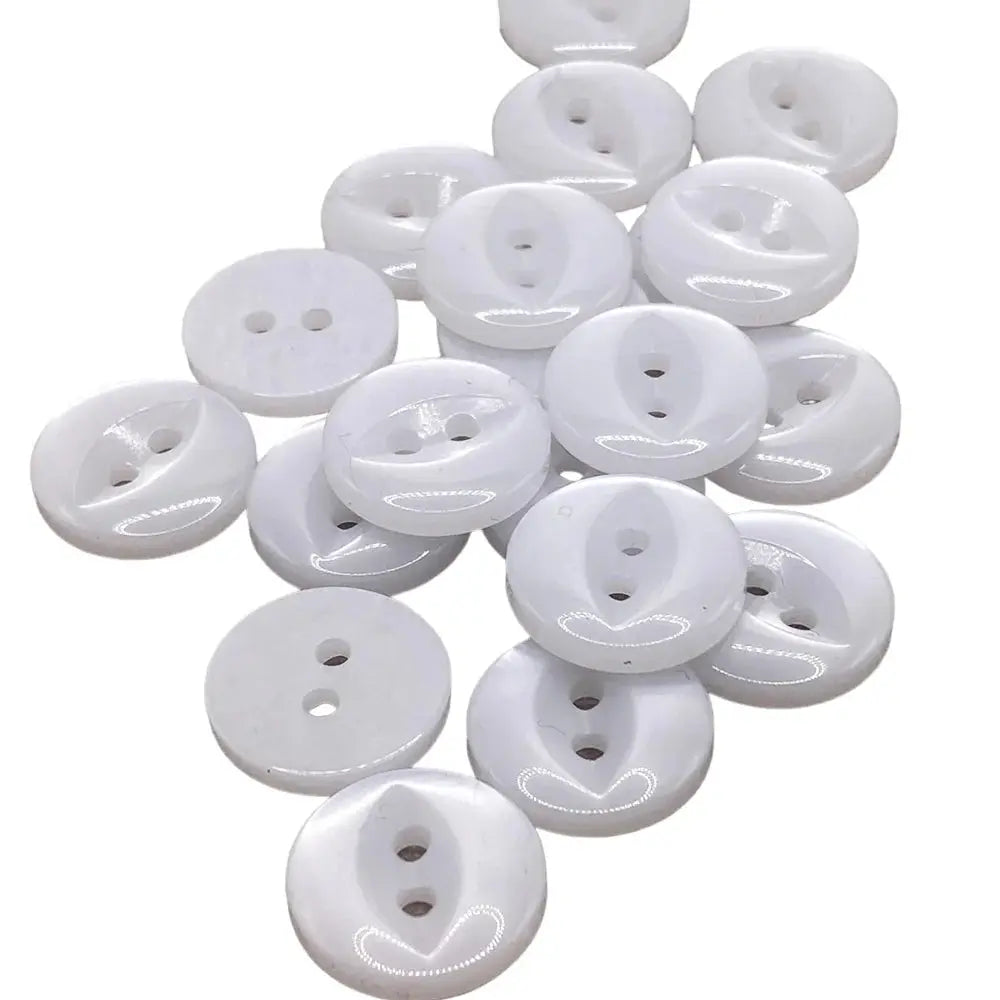 Pile of white two-hole buttons.