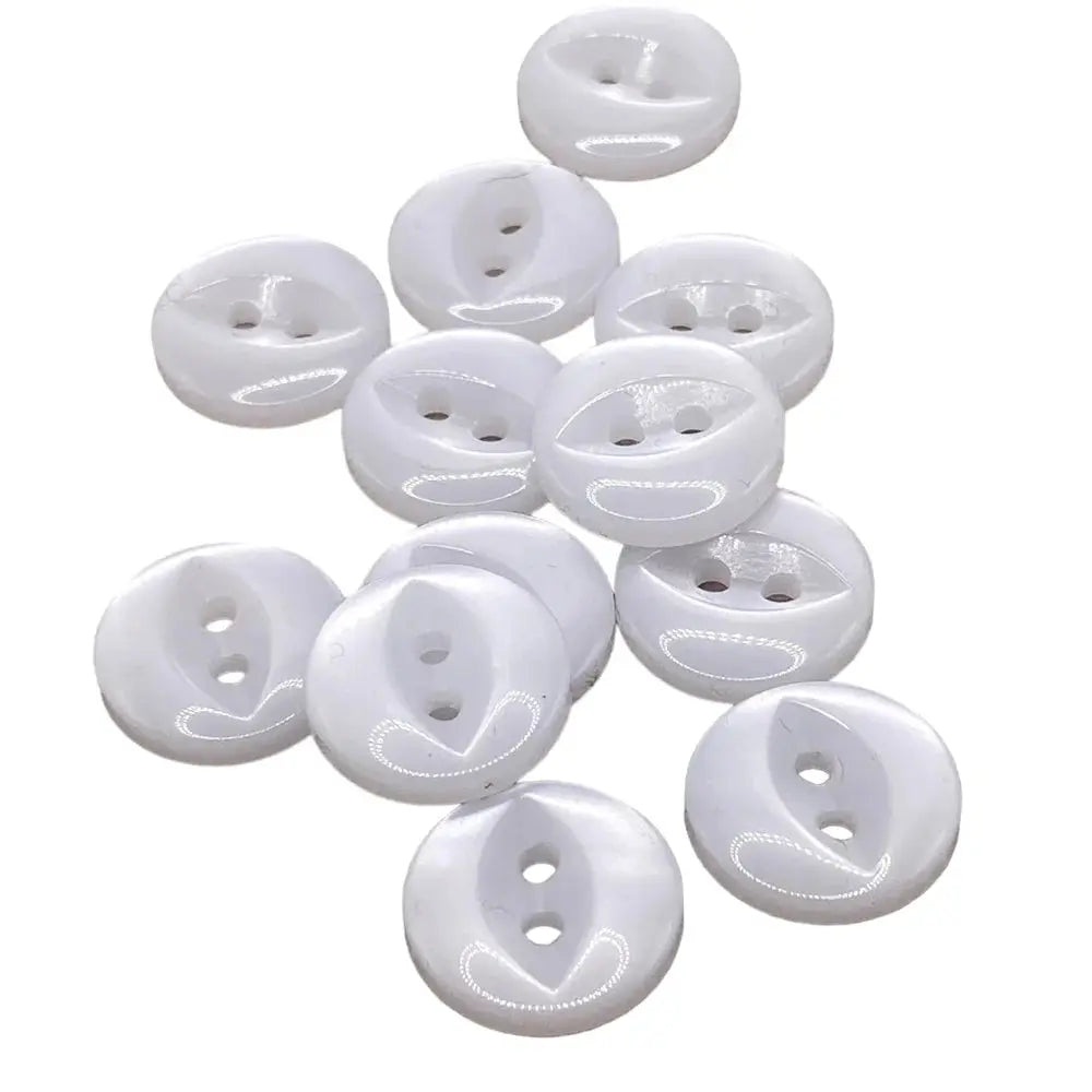 Pile of glossy white two-hole buttons.