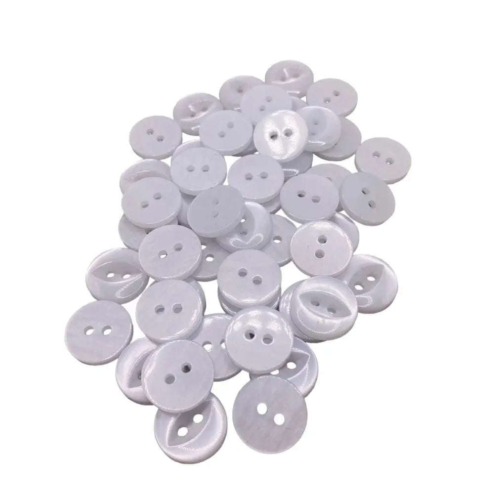 Pile of white, two-hole buttons.