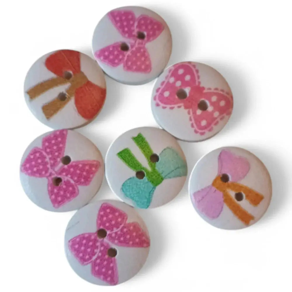 Assorted bow-decorated wooden buttons.