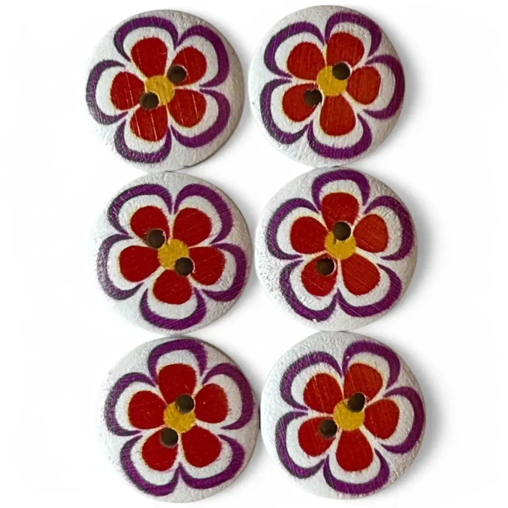 Six flower-painted wooden buttons.