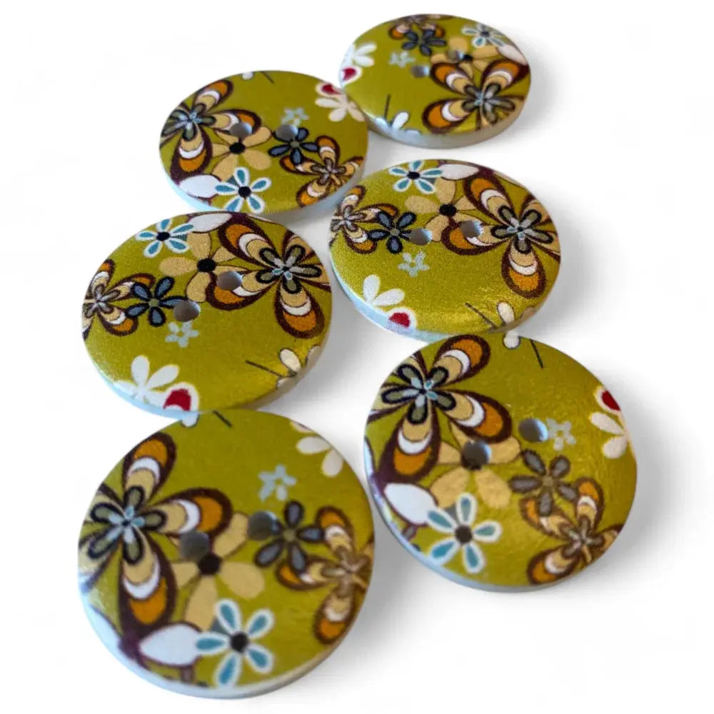 Six green floral patterned buttons.