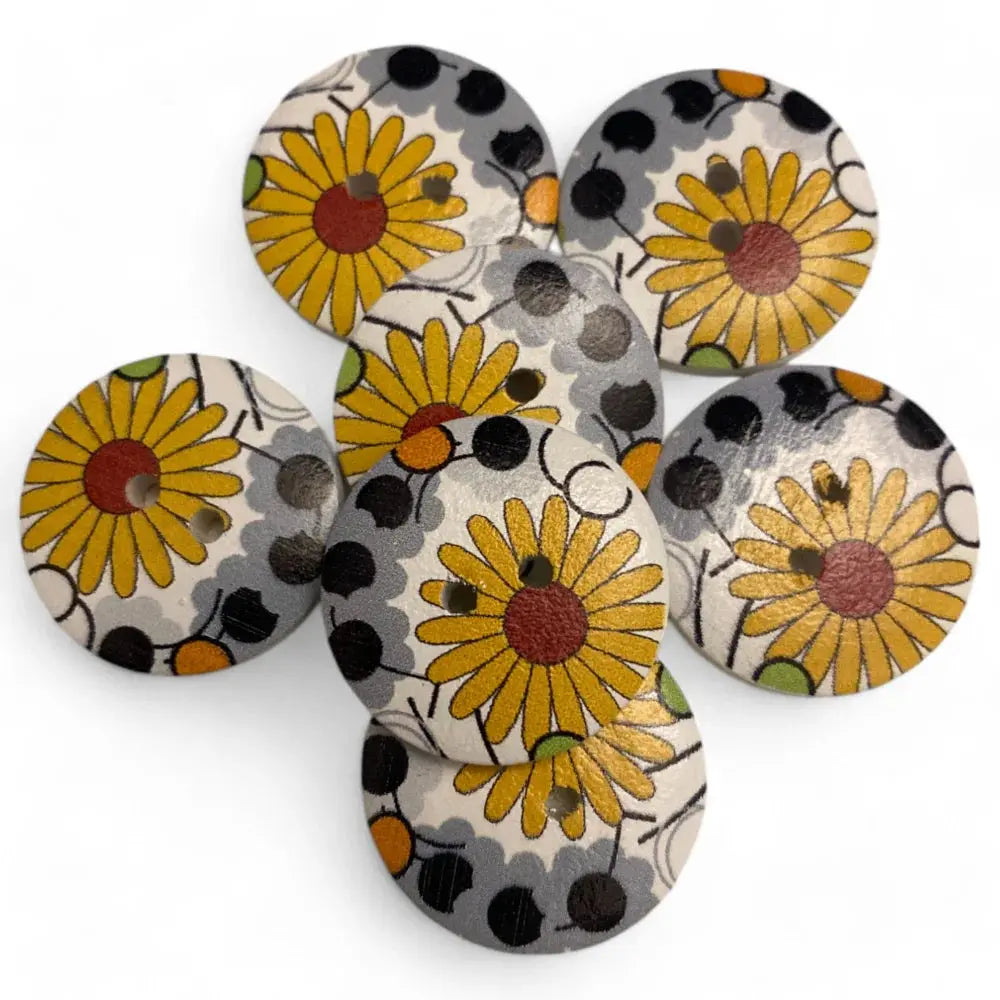 Circular wooden buttons with sunflower design.