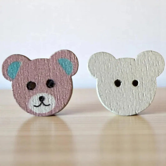 Two wooden bear-shaped buttons.