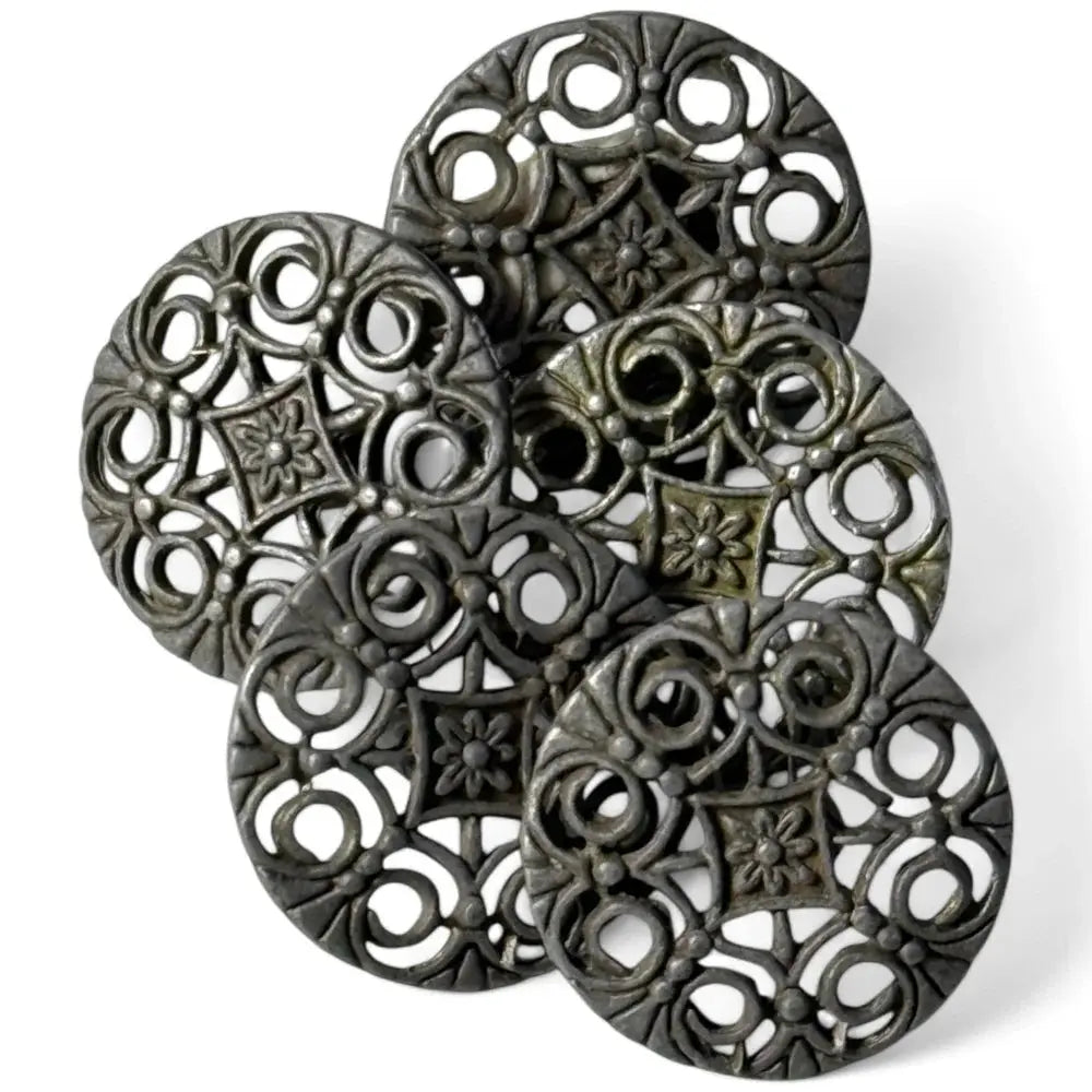 Ornate metal filigree coasters.